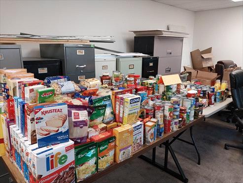 Weed Man Rochester Donates 641 Pounds of Food to Open Door Mission